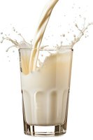 Milk pouring into glass with dynamic splash and droplets on white background, creating creamy texture for food and beverage advertising.