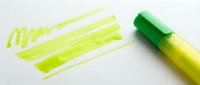 Bright yellow-green highlighter marker with cap off, displaying bold brush strokes and lines on white background. Isolated design element suitable for educational materials, office supplies, stationery graphics, and creative projects.