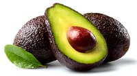 Fresh ripe avocados with one cut in half showing green flesh and brown seed, arranged with green leaf on white background for food photography.