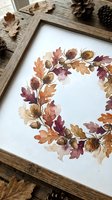 Watercolor autumn wreath with oak leaves, acorns and chestnuts in rustic wooden frame surrounded by natural fall elements for seasonal home decor and crafting.