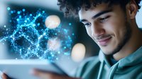 Young Hispanic man smiling while using digital tablet with glowing blue network visualization, molecular structure and particles emerging from screen in dark room.