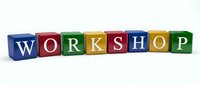 Colorful wooden alphabet blocks spelling WORKSHOP arranged in row on white background for educational training and business development concepts.
