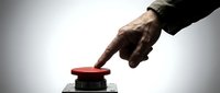 Male hand with dark skin tone pressing red emergency button mounted on metal base against white background. Concept for crisis response, alert system, or urgent action.