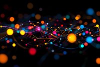 Colorful glowing dots connected by luminous lines on black background create abstract network pattern with bokeh effect, suitable for technology concepts.