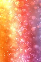 Dreamy abstract background with floating transparent bubbles and bokeh effects on gradient yellow, orange and purple backdrop. Suitable for creative designs.