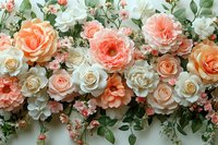 Romantic floral arrangement with peach and white roses, delicate green foliage creating elegant wedding backdrop or celebration decor composition.