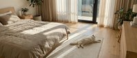 Serene bedroom interior with natural sunlight streaming through sheer curtains, featuring a neatly made bed with neutral bedding, wooden flooring, potted plants, and minimalist decor for home design projects.