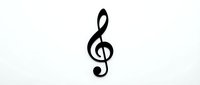 Black treble clef music symbol isolated on white background for musical designs, logos, and educational materials.
