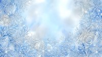 Frost-covered window glass with delicate ice crystal patterns and snowflake formations creating a winter seasonal background for holiday designs and cold weather themes.