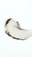 White cream cosmetic smear texture isolated on white background for skincare and beauty product design applications.