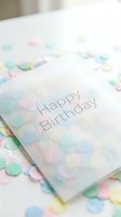 Happy Birthday greeting card surrounded by colorful pastel confetti on a white surface, soft light creating a festive and cheerful celebration mood.