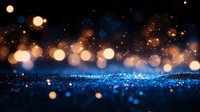 Magical glowing bokeh lights on dark background with blue sparkles and golden particles creating dreamy atmospheric effect. Perfect for festive designs.