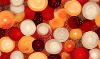 Abstract spiral pattern in red, orange and white tones with dotted texture creates dynamic circular composition for modern wall art and textile design.