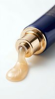 Luxury foundation makeup with gold pump dispenser pouring creamy beige liquid on white background for cosmetics advertising and beauty product promotion.