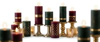 Luxury perfume bottles collection with elegant gold accents and rich colors arranged on white surface for premium fragrance branding and cosmetic design.
