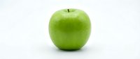 Fresh green apple isolated on white background, ready for healthy eating, nutrition, and food design projects.