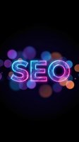 Neon SEO text with colorful bokeh lights on dark background for digital marketing and search engine optimization concepts.
