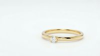 Elegant gold engagement ring with sparkling diamond solitaire on clean white background, isolated for jewelry design and wedding concepts.