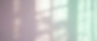 Soft pastel gradient background with dreamy bokeh lights in pink and mint green tones for romantic designs and spring projects.