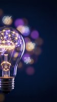 Light bulb with glowing brain network inside surrounded by floating tech icons representing artificial intelligence and innovation concepts.