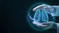 Medical professional hands protecting glowing lungs hologram representing respiratory health care and pulmonary medicine concept on dark background.