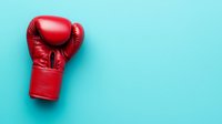Red leather boxing glove on vibrant turquoise background with copy space. Minimalist sports composition for boxing, fighting, competition and strength concepts.