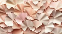 Delicate paper art background in soft pink and beige tones featuring layered fan-shaped elements creating dimensional texture. For wedding design and luxury packaging.