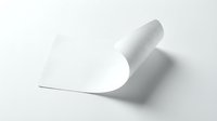 Curved white paper sheet with elegant fold creating dynamic shadow on clean background for modern design projects and presentations.