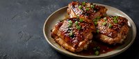 Glazed pork chops with herbs on ceramic plate, grilled meat dish for restaurant menu, cooking blog, food photography and culinary advertising.