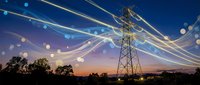 High voltage electrical transmission tower with glowing power lines against dramatic sunset sky. Energy infrastructure and electricity distribution concept.