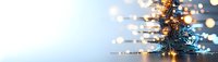 Abstract digital technology background with glowing fiber optic lights and bokeh effects against blue gradient, suitable for tech innovation concepts.
