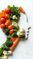 Fresh vegetables arranged in female face silhouette on white background. Creative healthy eating concept with tomatoes, broccoli, cauliflower, carrots and lettuce.