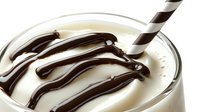 Creamy vanilla milkshake with chocolate syrup drizzle in glass and striped straw, perfect for dessert menu photography.
