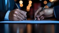 Close up of hands signing business documents with pens against blurred bokeh lights background, representing contract agreement and partnership deal.
