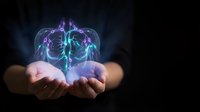 Hands holding glowing neon brain with neural connections and energy waves, representing artificial intelligence, innovation, technology, and digital transformation concepts.