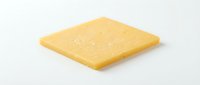 Single yellow cheese slice isolated on white background, ready for food packaging, menu design, and culinary marketing materials.