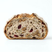Artisan bread loaf cross-section showing open crumb structure with dried fruits and seeds, ideal for bakery, food, and culinary design projects.