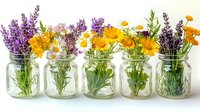 Fresh spring flowers in glass mason jars arranged in row, including lavender, daffodils, daisies and marigolds against light background, creating rustic garden display.