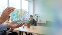 Business professional hands protecting digital technology icons in modern office environment for corporate innovation and data security concepts.
