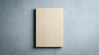 Blank wooden cutting board on gray concrete surface for kitchen cooking and food preparation mockup design projects.
