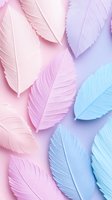 Delicate paper feathers in pastel pink, lavender and blue tones creating soft textured composition on gradient background. Suitable for feminine designs.