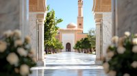 View through ornate marble archway of mosque with minaret and courtyard, framed by white flowers and greenery. Peaceful Islamic architecture.