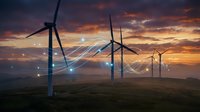 Wind turbines with glowing connection lines at sunset representing renewable energy network and smart grid technology for sustainable power generation.