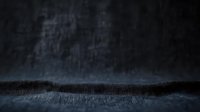 Dark atmospheric background with misty fog effect floating over textured surface, creating moody and mysterious ambiance for dramatic product photography or horror concepts.