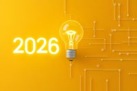 Glowing light bulb with 2026 number on vibrant yellow background with circuit pattern, symbolizing future innovation and technological advancement.
