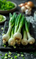 Fresh spring onions with white bulbs and green stems on dark background, perfect for cooking and food blog content. Rustic kitchen setting with natural ingredients and moody lighting.