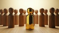 Golden figure stands out among wooden crowd representing leadership excellence and unique talent in business teamwork concepts.