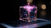 Glowing transparent cube with magical purple and blue sparkles floating on laptop keyboard, creating mystical atmosphere against dark background with bokeh effect.