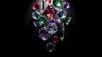 Collection of colorful precious gemstones diamonds emeralds rubies sapphires on black background for luxury jewelry design and investment concepts.