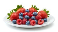 Fresh mixed berries on white plate isolated on transparent background for healthy eating and culinary designs.